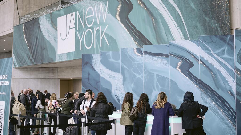 JA New York will display new branding at its upcoming spring jewelry trade show, scheduled for March 10 to 12 at the Jacob K. Javits Convention Center in New York City. (Photo credit: Lucas Botz Photography) 2024 JA New York Spring show signage